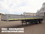 Бортовой полуприцеп МАЗ 938660-2010 грузоподъёмностью 28,4 тонны с кузовом 12290х2440х660 мм (фото 1)