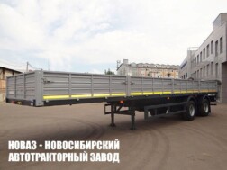 Бортовой полуприцеп МАЗ 938660‑2010 грузоподъёмностью 28,4 тонны с кузовом 12290х2440х660 мм
